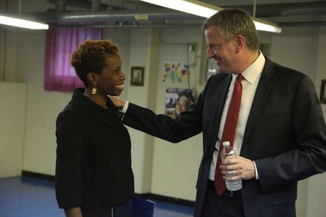 New York City Housing Authority chair Shola Olatoye with Mayor de Blasio at Lincoln Houses in Harlem when she was appointed in 2014. She is under fire after city investigators said she falsely certified that NYCHA had inspected thousands of apartments for lead paint; the mayor has been caught up in the scandal because he knew for over a year the inspections hadn't taken place, but never disclosed it. Photo: Ed Reed&#xa0;/ Mayoral Photo Office,&#xa0;via flickr