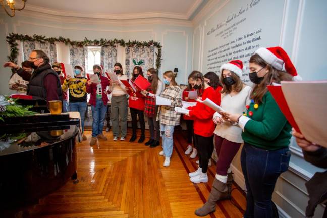 MWHS Choir sang holiday music at Rest Haven after Santa's landing in Museum Village.