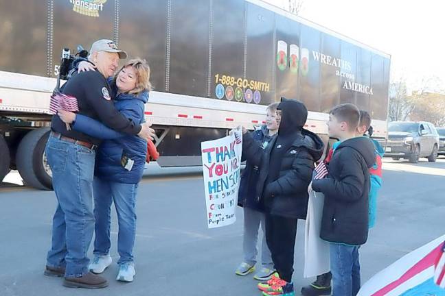 CJH Teacher Patty Capocciamo hugs United States Army Veteran Ervin Henschel.