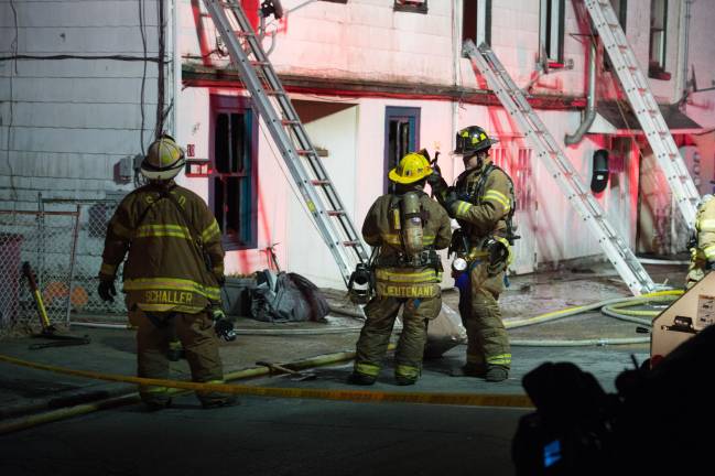 Goshen, NY Jan 13 2018. Firefighters at of multi-dwelling aparment block.