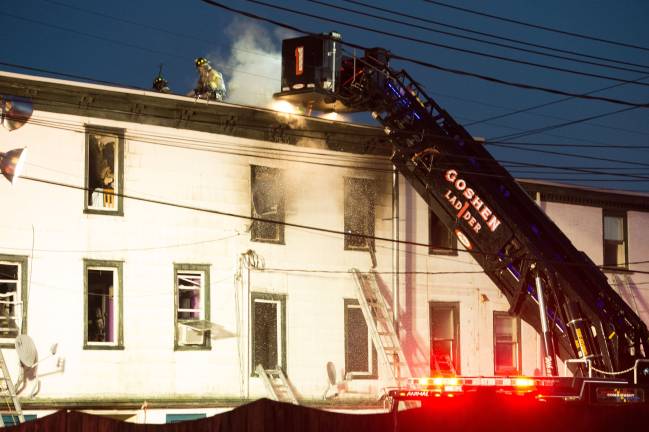 Goshen, NY Jan 13 2018. Firefighters break out the roof, but building damage is extensive