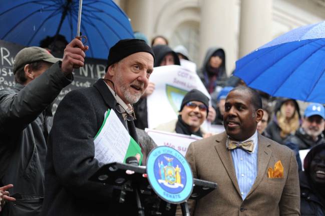 Steve Coe, the CEO of the Battery Park nonprofit Community Access, on the steps of City Hall in February 2014 during a press conference in which he urged local and state legislators to help initiate crisis intervention teams within police departments. To his right, state Senator Kevin Parker, also an advocate for the teams.