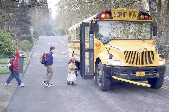 Among the precautions being taken by school districts will assigned social distant seating and a plan where buses are filled from the back to the front. Photo illustration by Holger Selover-Stephan from FreeImages.