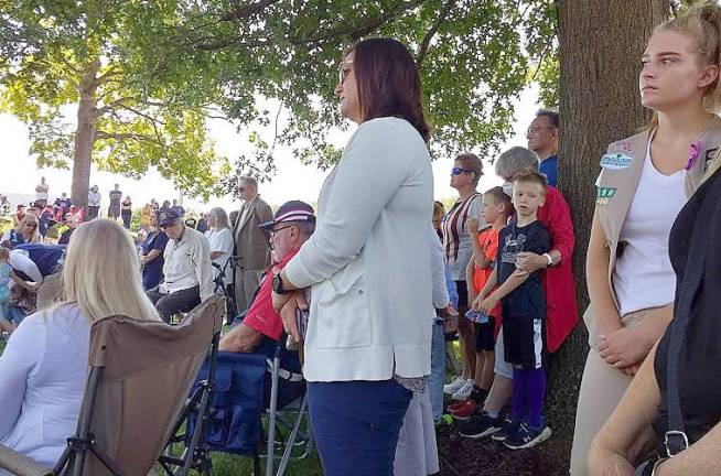Members of the community look on solemnly during the 9-11 ceremonies last Saturday in Chester.