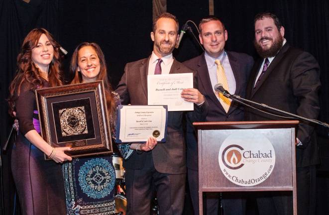 Chabad Honorees Russell and Jodi Cohen of Highland Mills receive the Lamplighter Award. Pictured with Rabbi Pesach and Chana Burston and County Executive Steve Neuhaus.