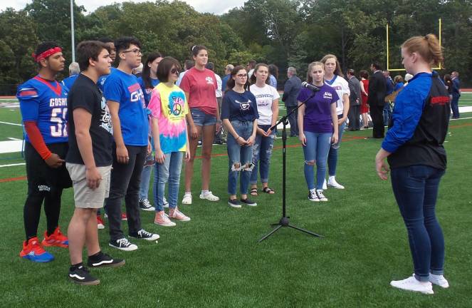 The Goshen High School Chorus sings the National Anthem