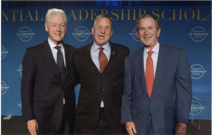 Graduating from the Presidential Leadership Scholars Program in 2016, with former presidents Bill Clinton and George W. Bush.