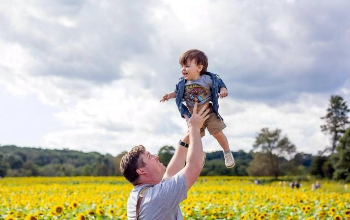AJ Schmitt of Chester, N.Y., came to visit the Sussex County Sunflower Maze with little AJ, his 21-month-old son. (Photo by Sammie Finch)