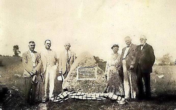 Hambletonian monument dedication at the Wakely Bankerfarm in Sugar Loaf on Aug. 13, 1935. Pictured from left to right are: W. Sanford Durland, Harry Kningle, Frank Dalage, Carrie Houston, grandaughter of Jonas Seely, Joseph J. Mooney, President, Hambletonian Association, and Dr. Seely Cummings, grandson of Jonas Seely. The monument was moved across the road next to Banker’s barn in 1995 when a developer built houses on the site. Photo courtesy of the Chester Historical Society.
