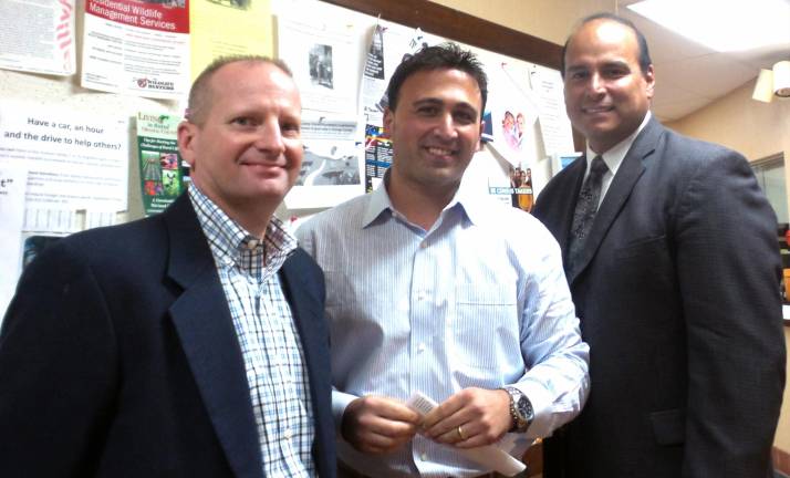 Keith Scerbo, Orange &amp; Rockland general manager in charge of smart meters; Mike Pinto, project manager; and Eric Fuentes, manager of public affairs, at the Aug. 28 town board meeting.