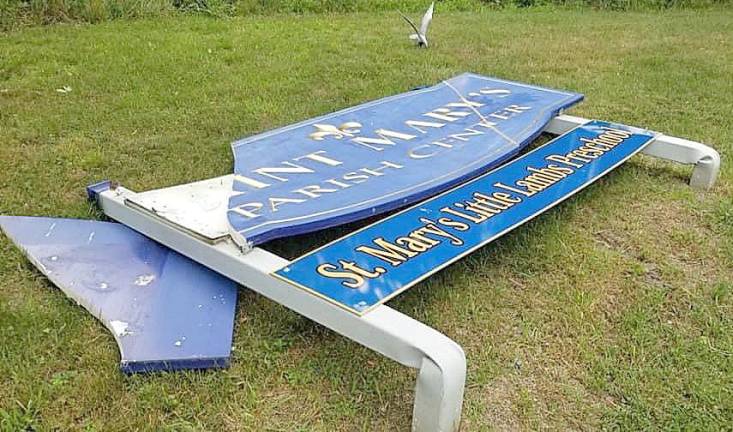 The same night the flag pole at the 9-11 Memorial in Washingtonville was cut, a vandal or vandals also toppled the sign for nearby St. Mary's Parish Center.