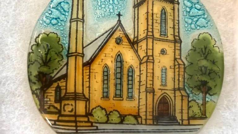 This year’s ornament features St. James’ Episcopal Church, one of the village’s most recognizable and enduring landmarks.