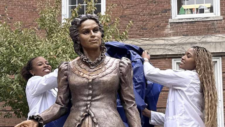 SUNY Medical Students unveil the bronze sculpture of Dr. Loguen Fraser, the first African American woman to graduate with a medical degree from SUNY.