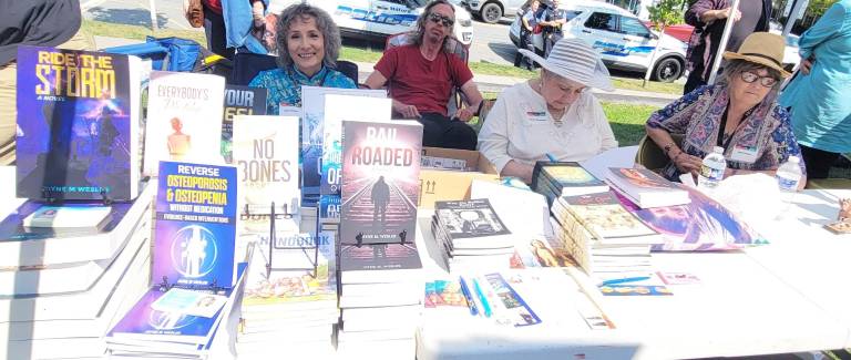 Regional authors sign their books at a past Milford Readers &amp; Writers Festival. Provided photos.