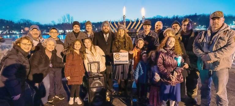 Celebrants in front of the six-foot menorah at the Monroe lighting