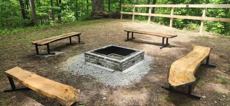 Handmade benches and a new firepit were among the items installed at Braeside Camp as part of a Scouts project.