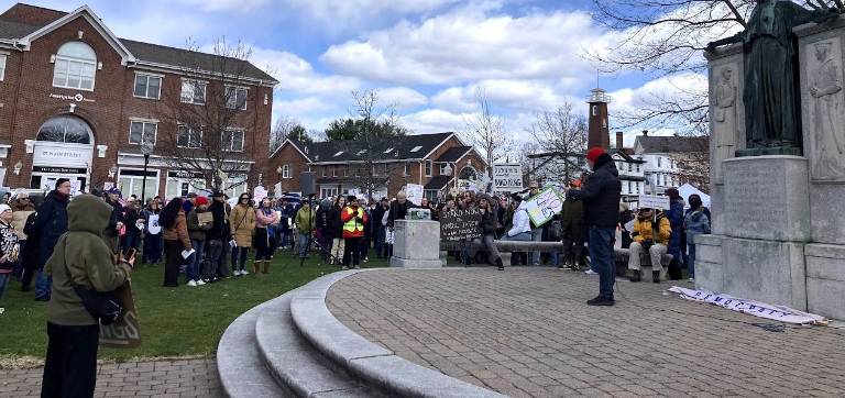 Speaker addresses crowd at No Kings rally.
