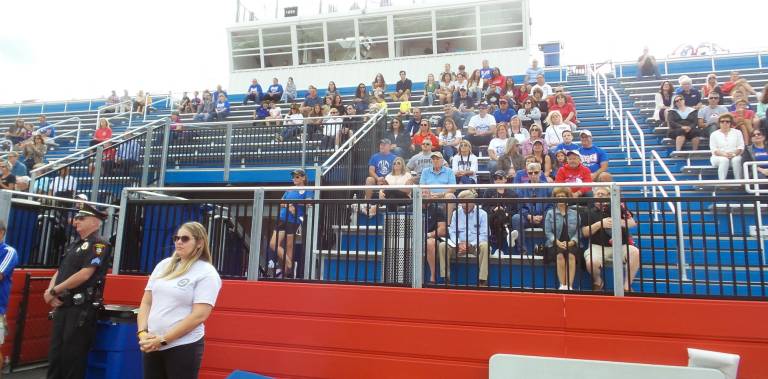 The crowd moves into their seats to watch the game against Highland.