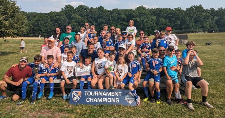 The champion Goshen Warriors with their friends and families following their victory in the U9 boys division at the Hershey Summer Classic 2023 soccer tournament.