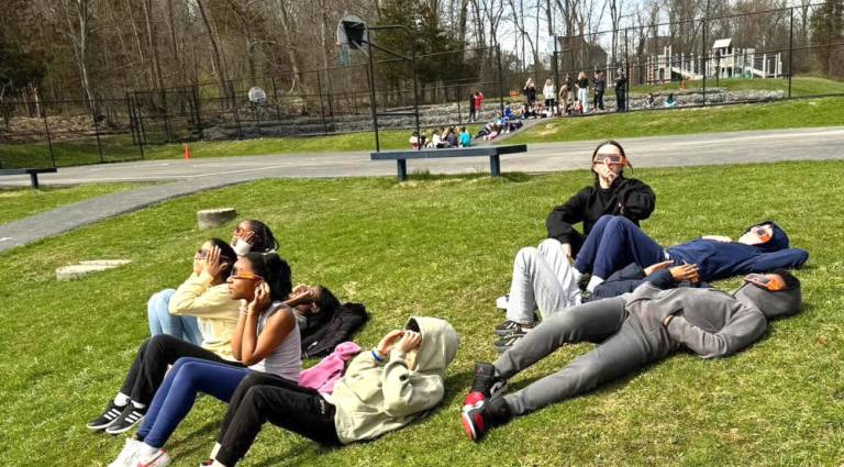 Chester Academy students could be seen lounging on the lawn as the eclipse took place Monday afternoon.