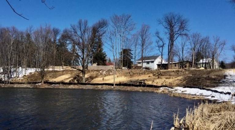 Angry over eyesore distillery developing at Creamery Pond