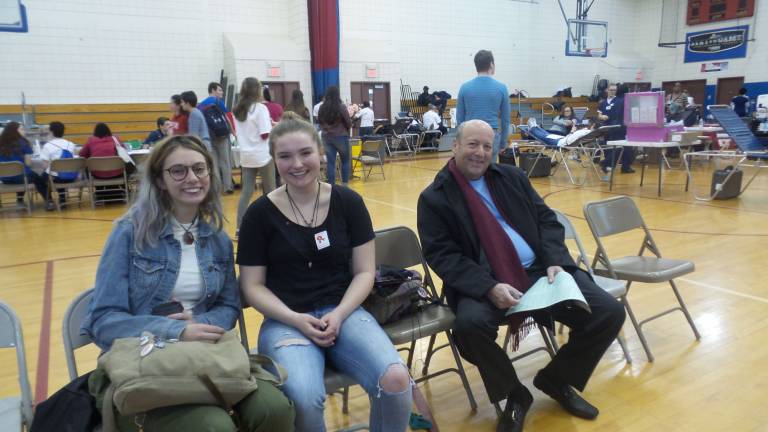 Riley Mead, Kelly McCloud and Joel S. Finkelstein giving moral support as they wait to give blood (Photo by Frances Ruth Harris)