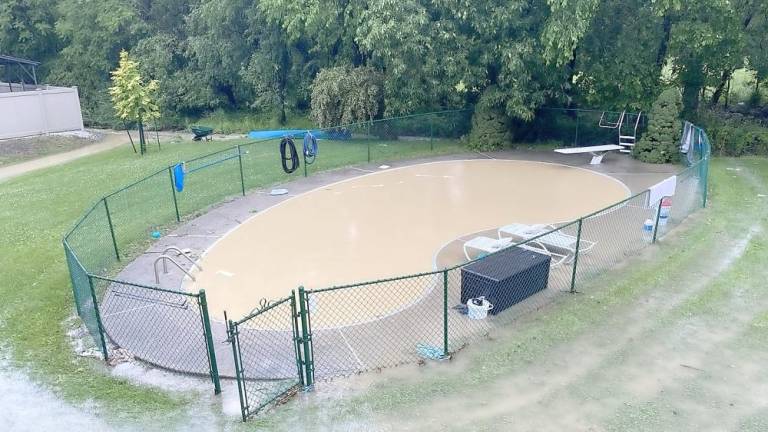 Ed Winter's muddy swimming pool after runoff from The Greens of Chester.