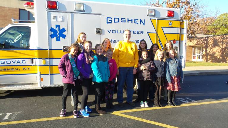 From left: Aliana Vanichpong, Ella O'Brien Buruno, Leader Heather O'Brien Buruno, Tracy McClintock, Kyla Kropp, Kristin McClintock, Captain David Grippe, Alissa Cecere, Stephanie Cecere, Paulina Bowman Carroll, Eva Colangelo, Maggie Mullins, and Patti Stickley (Photo by Frances Ruth Harris)