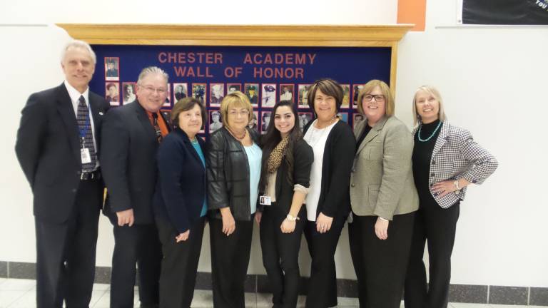 At the Chester Academy, from left: Mike Fields, Assistant Principal, Career and Technical Education Center, BOCES; William J. Hecht, District Superintendent/CEO, Orange-Ulster BOCES; Martha Boghart, BOCES representative to the Chester District and vice president of Goshen School Board; Dorothy Slattery, BOCES Cooperative Board President; and Amanda Almodovar, Chester Academy senior student participating in Student Education and Management Program at CTE; Kerri Strdka, Director of Special Education; Deborah McBride Heppes, Assistant Superintendent for Finance, BOCES; and Virginia Esposito, BOCES board member (Photo by Frances Ruth Harris)