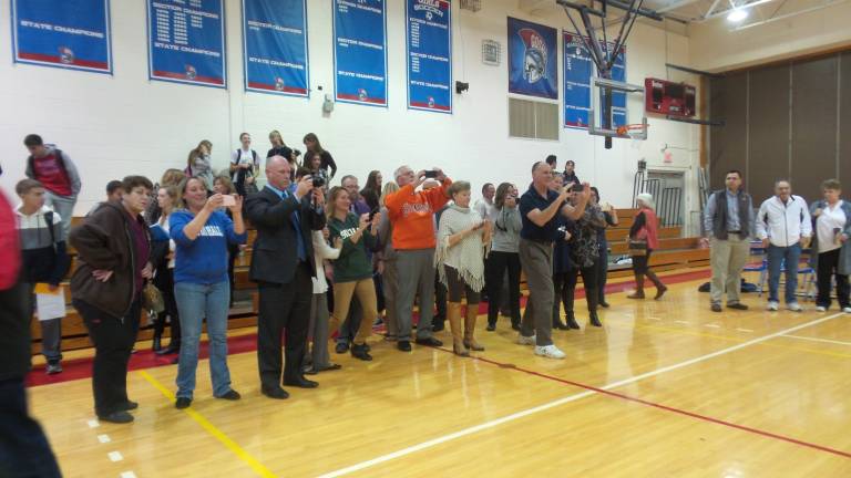 A supportive community records a very special event (Photo by Frances Ruth Harris)