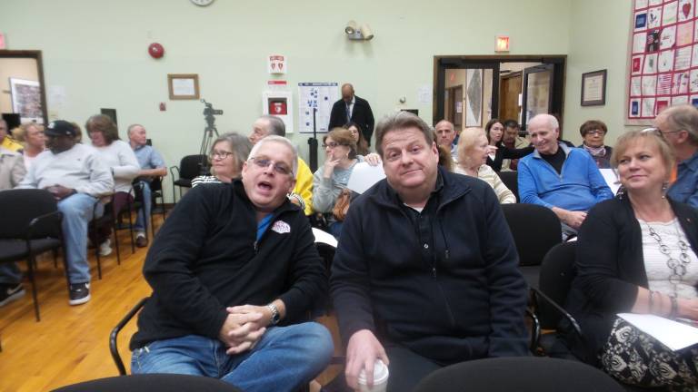 From left: Walt Papailo; Frank Sambets, Chester school board president; and Sandy Nagler, Chester school board member; they arrived early to sit in a row near the front of the room. (Photo by Frances Ruth Harris)