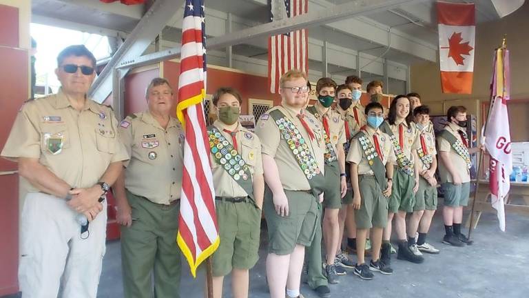 From left, Jeffery Albanese, Scoutmaster Troop 63; James Cassel, Charter Representative and Committee Member; Life Scout Eric Bunzey; Jack Callahan; Jack Donohue (mostly hidden); Blake Albanese; Zachary Goodman; Tristan Brideweser (rear); Javier Rodriquez; Tallon Clark (rear); Brandon Arroyo; Jack Loughran; Reese Donohue; Life Scout Daniel Hartley.