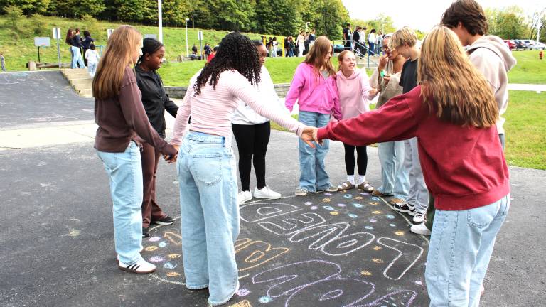 Chester Academy students participate in the ‘Chalk about Love’ campaign to raise awareness about teen dating violence.