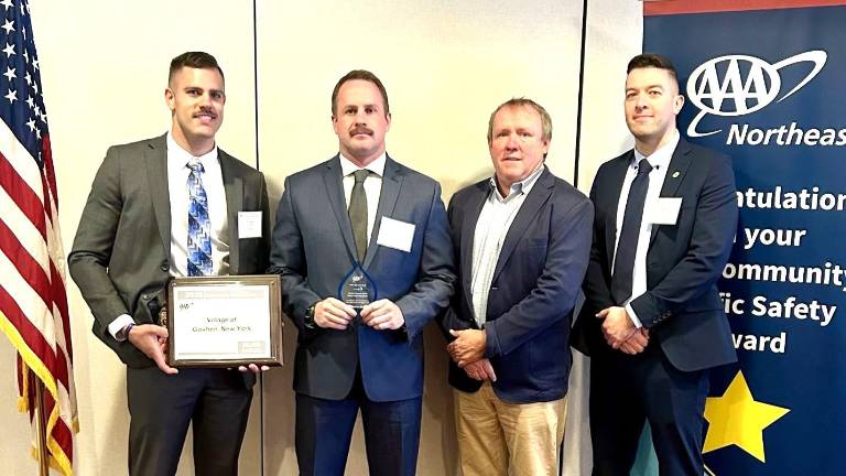 Pictured left to right: Village of Goshen Police Traffic Safety Officer Cody Hunt, Drug recognition expert, Officer Francis Winski, AAA Vice President of Public and Government Affairs John Corlett, Village of Goshen Police Sergeant David Yates.