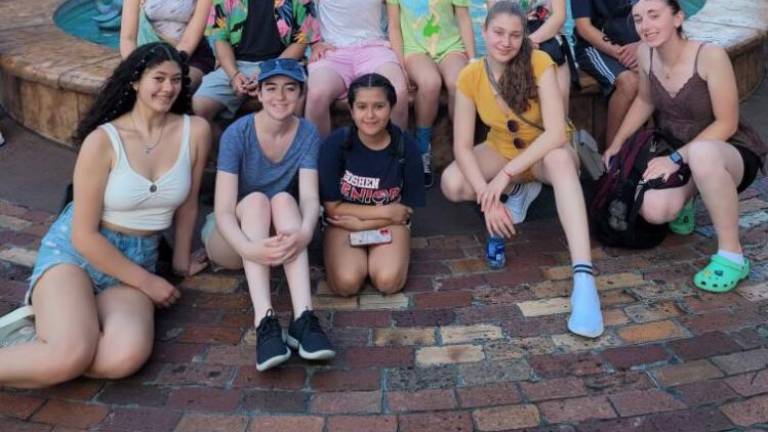 Goshen High School seniors under a Miss Piggy fountain in Hollywood Studios. Back row: Catherine Lienemann, Tanvir Signh, Gabe Kaufman, Madison Allan, Ash Kryou, Joseph Carmona. Front row: Aliana Vanichpong-Barbosa, Hannah Fruhling, Mia Colangelo, Michelle Gukhman, Lindsay Keane.