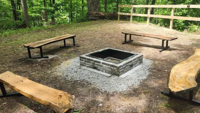 Handmade benches and a new firepit were among the items installed at Braeside Camp as part of a Scouts project.